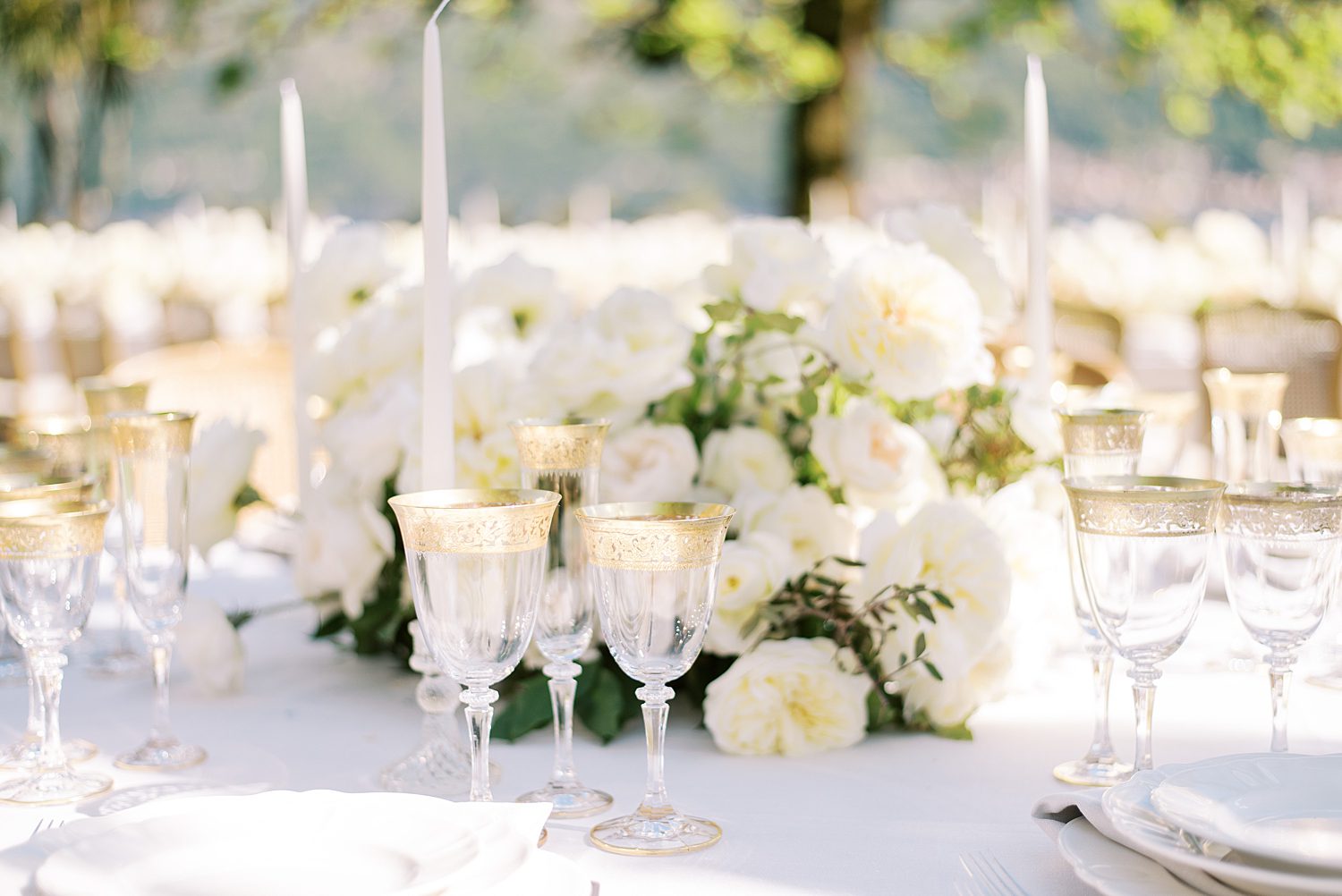 garden wedding reception with taper candles and white roses at Villa Balbiano