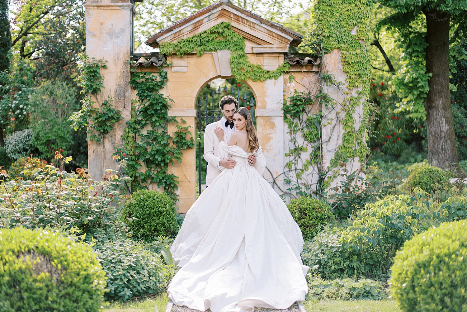 off-the-shoulder wedding gown with full skirt by Ines Di Santo
