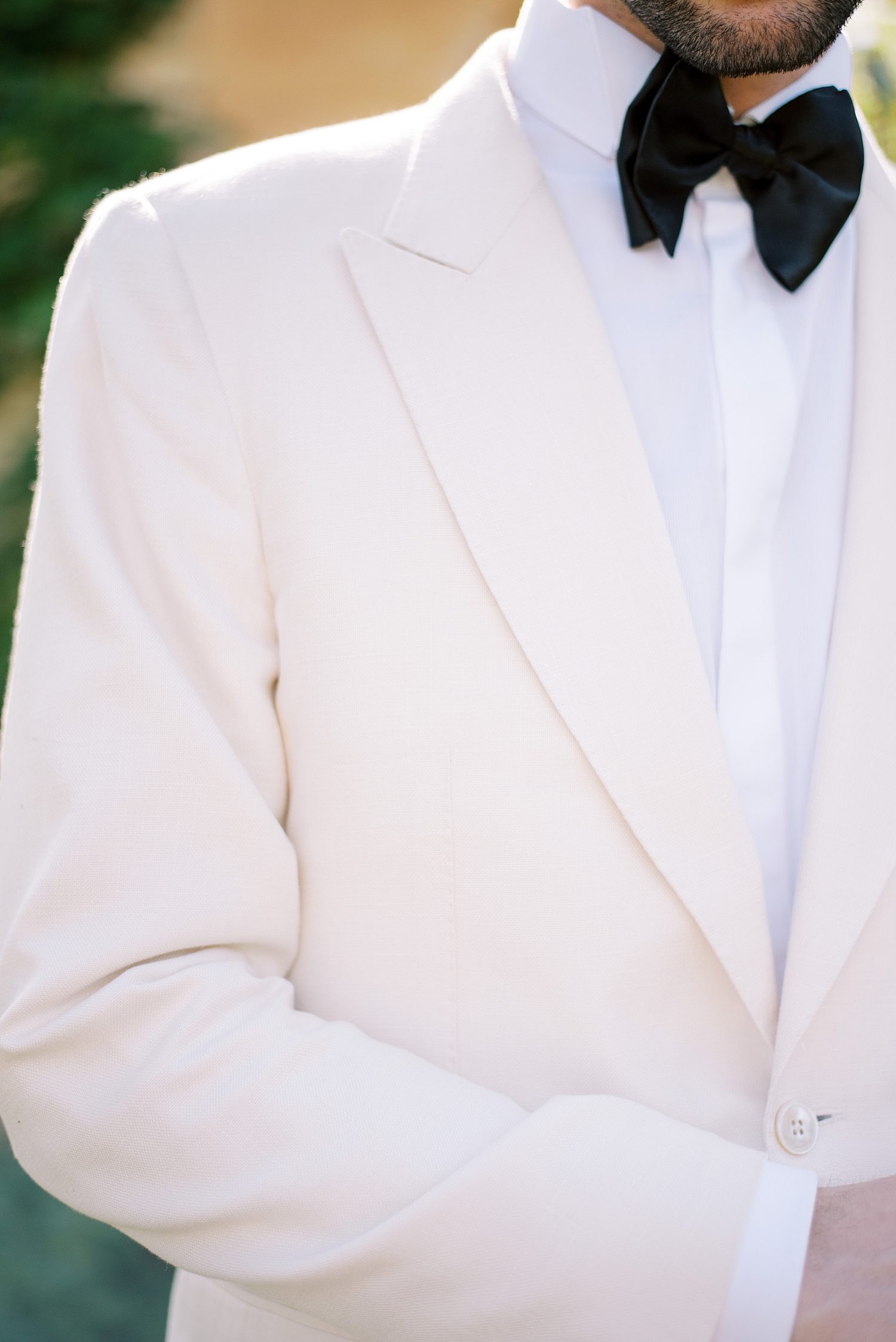 ivory suit jacket with black bow tie at Villa Balbiano