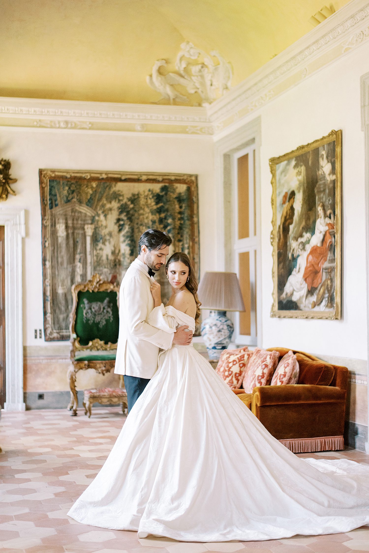 bride and groom hug inside Villa Balbiano