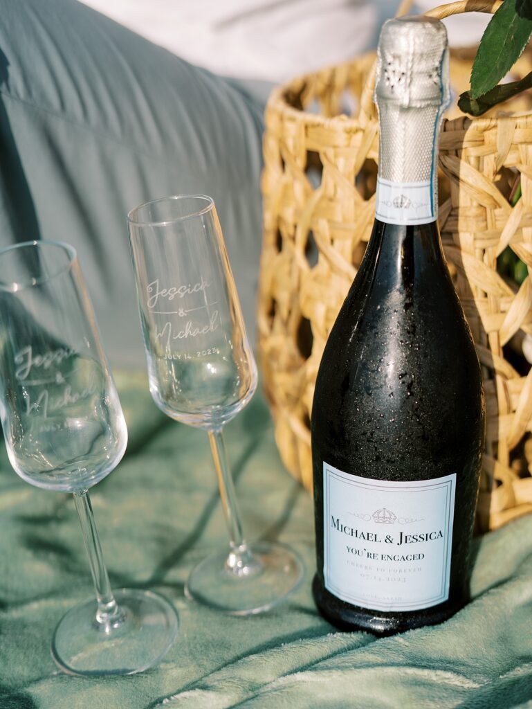champagne and two glasses with custom etching for Davis Island engagement session