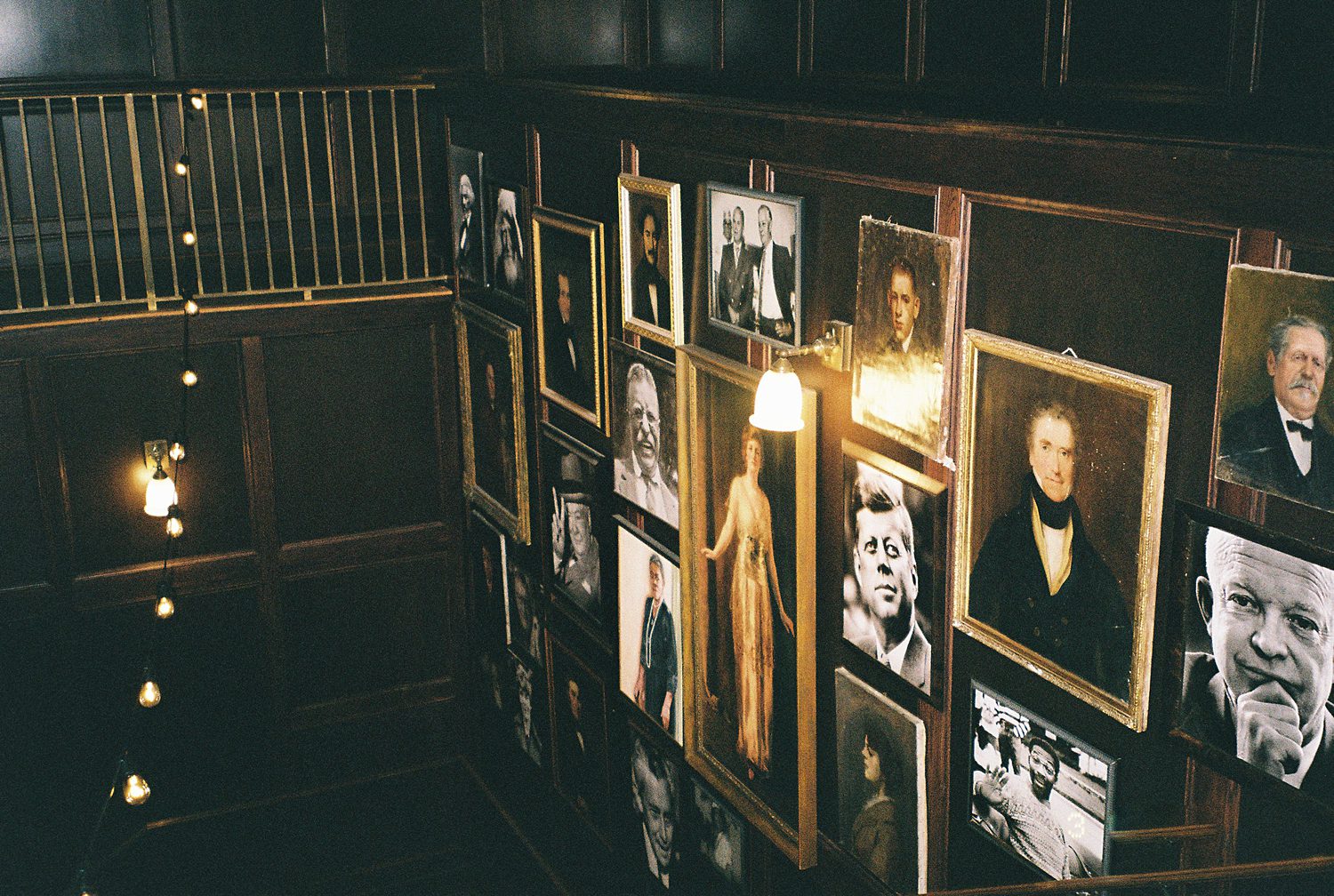 portraits on staircase inside the Oxford Exchange