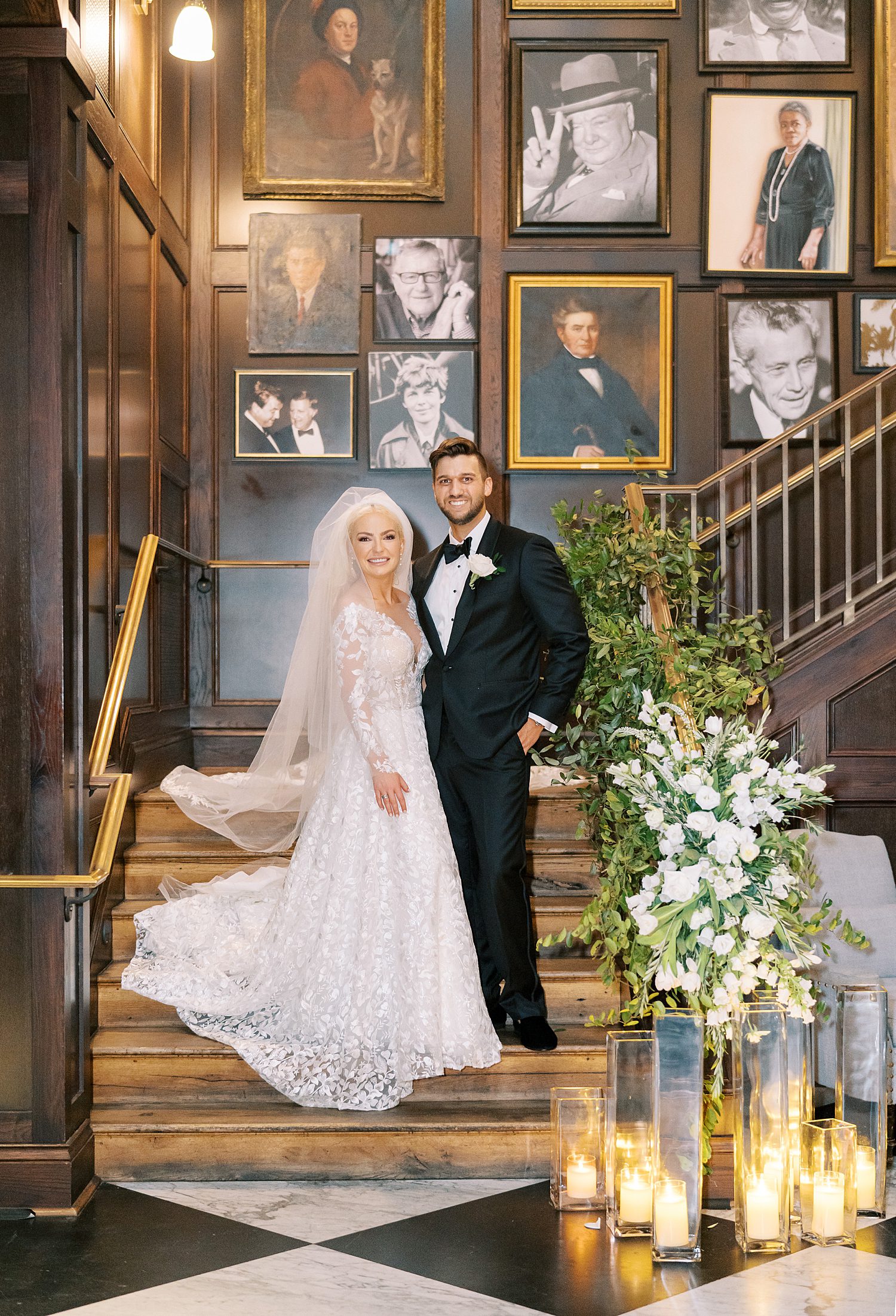 bride and groom stand on main staircase inside the Oxford Exchange