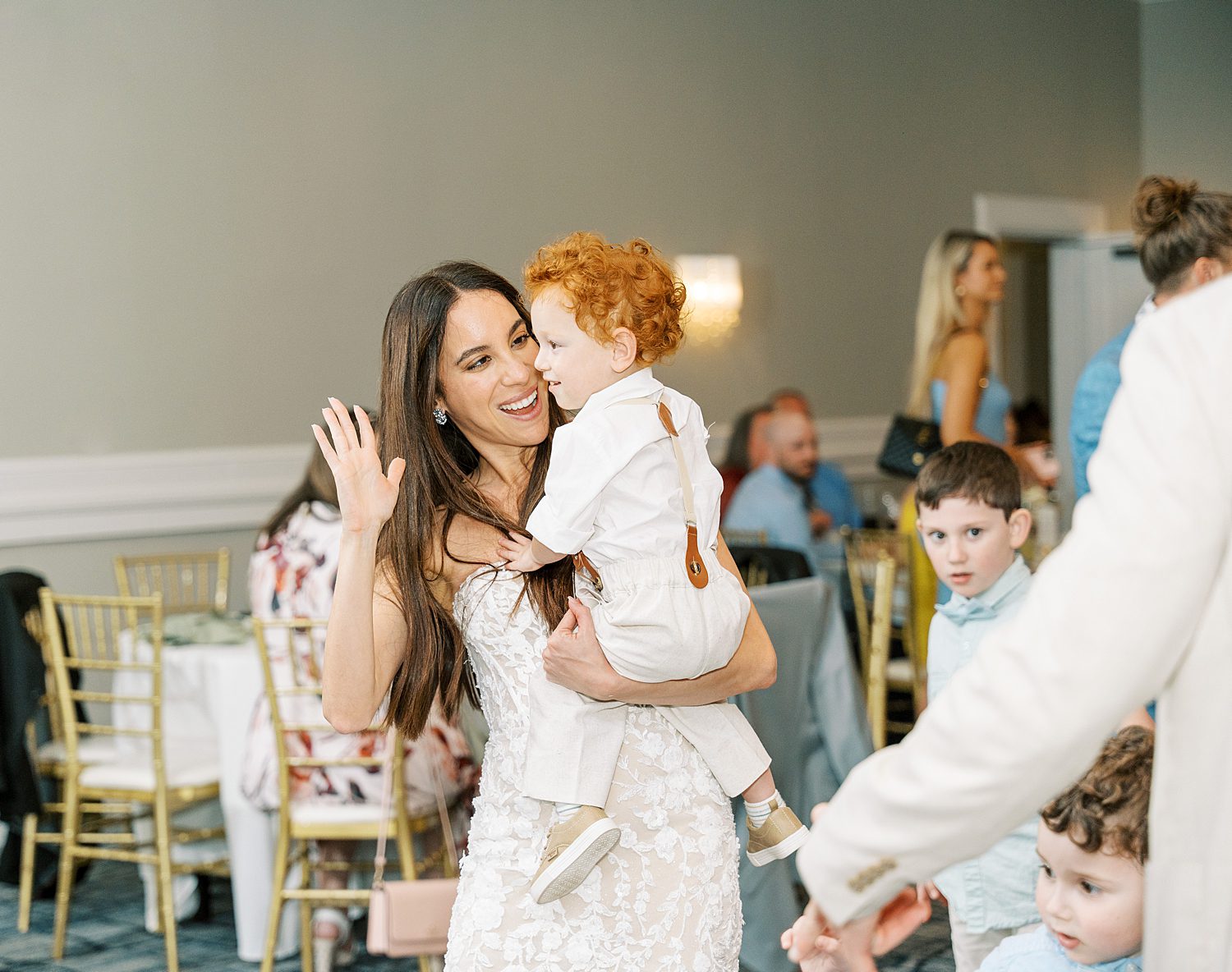 bride dances with son during reception party 