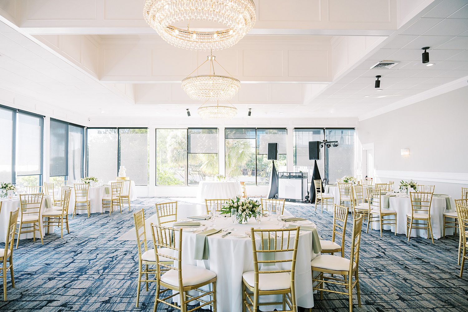 wedding reception with gold, white, and green accents at the Rusty Pelican Tampa