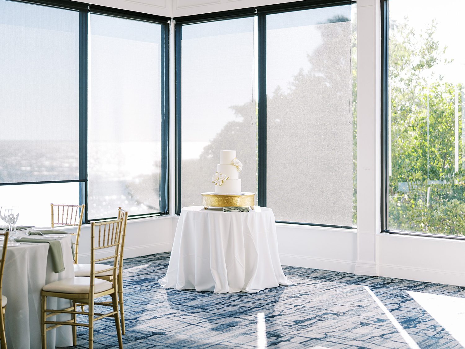 wedding cake sits in table in the corner of the Rusty Pelican Tampa