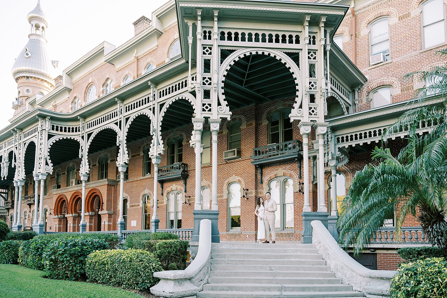 University of Tampa engagement photos for couple in white dress and tan suit