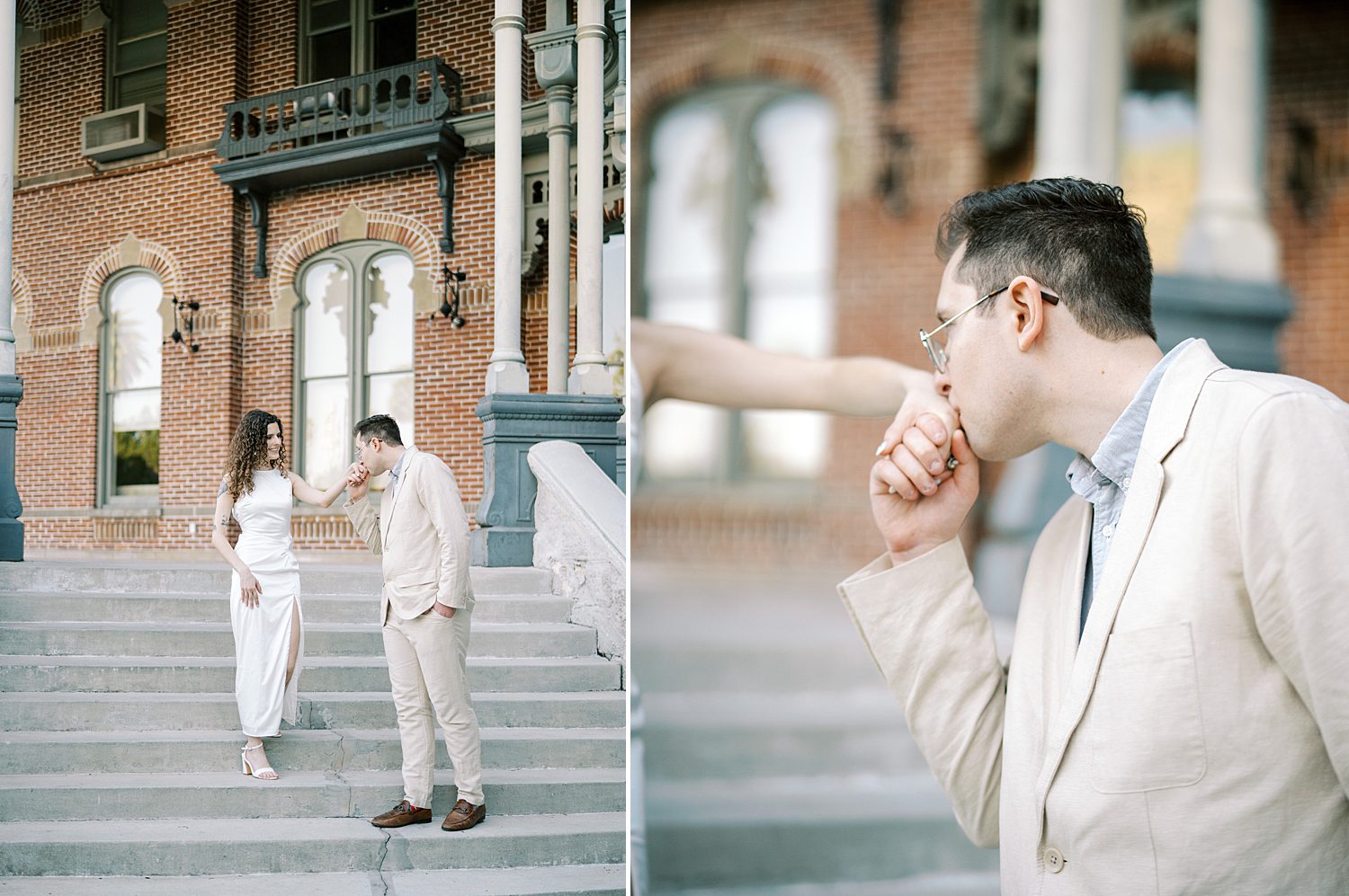 man kisses woman's hand walking down staircase during University of Tampa engagement photos 