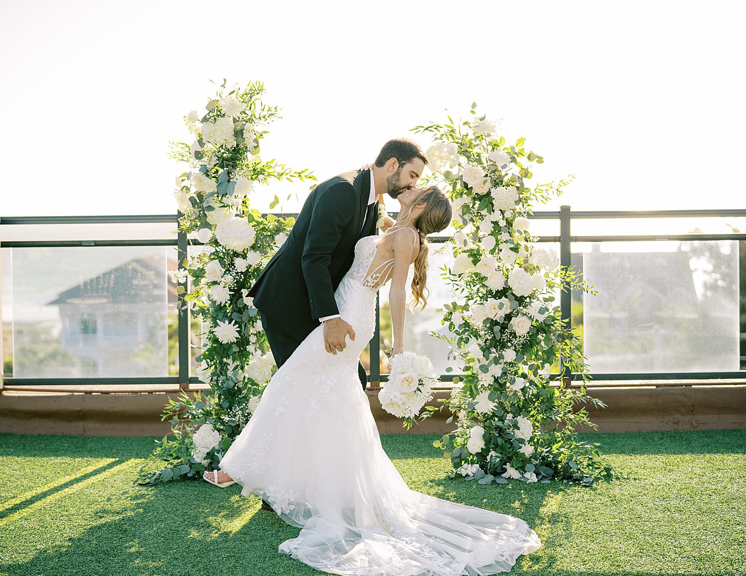 couple kisses on rooftop at the Hotel Zamora