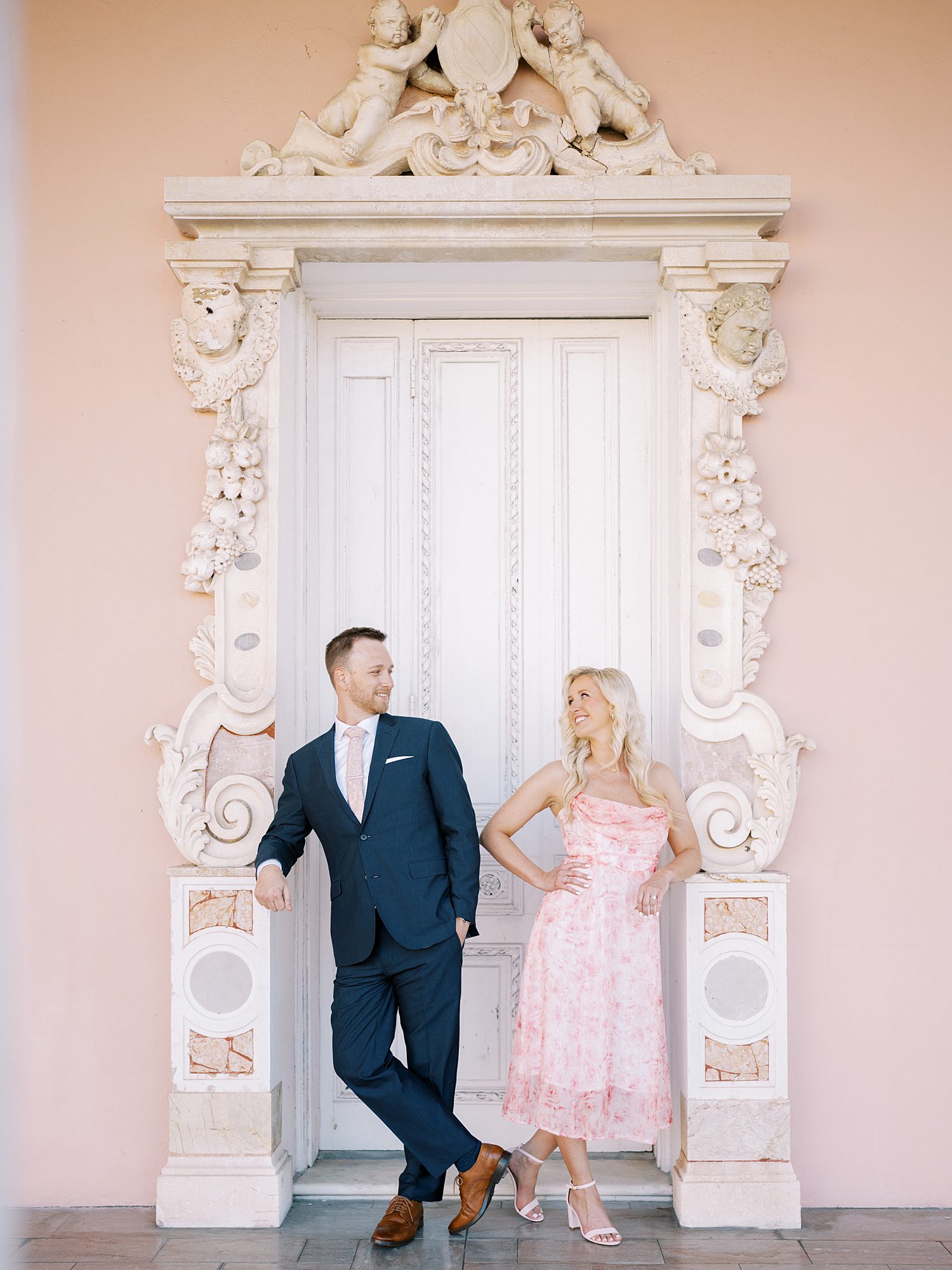 man and woman stand leaning in doorway at The Ringling Museum